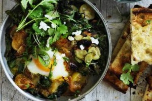 与鹰嘴豆和土耳其面包的绿色shakshuka。